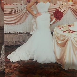 Worn once for my wedding . It comes with the veil as shown in the picture